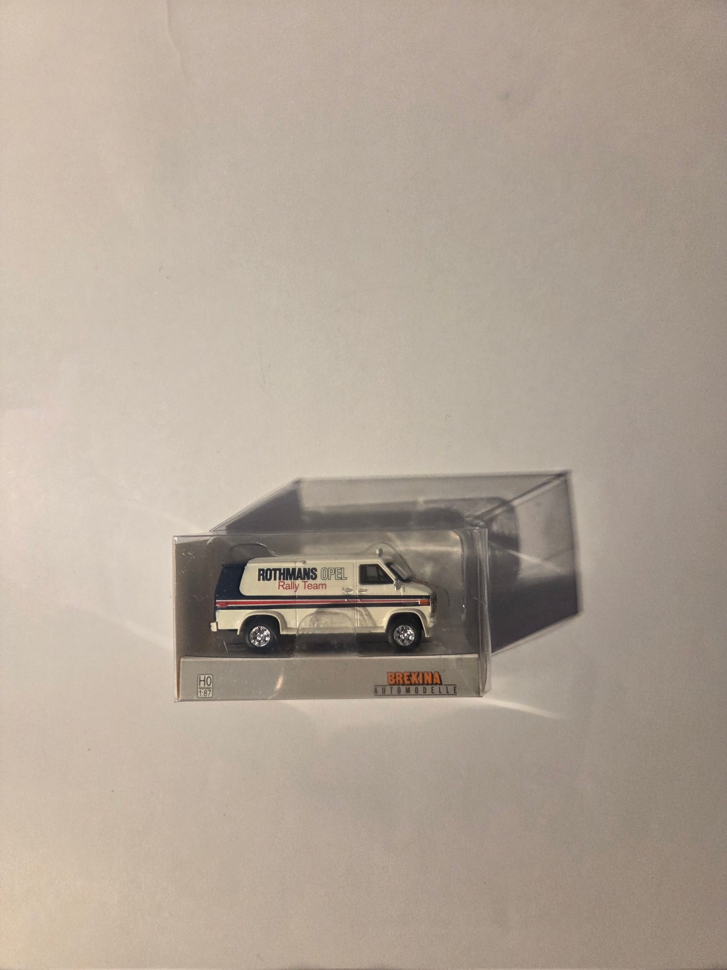 HO scale model railroad Vehicle - Brekina HO 18257 Vehicle 1970s GMC Verdura Cargo Van - Assembled Rothmans Opel Teams (white, black, red)