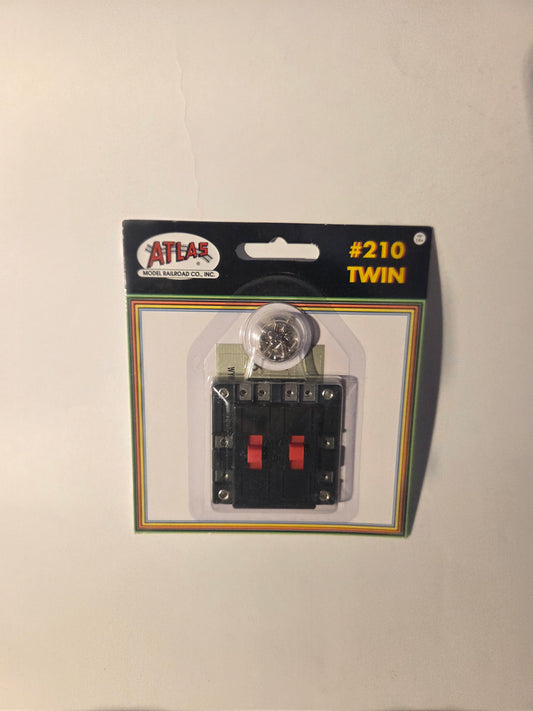 HO scale model railroad electrical component - Atlas HO 210 Electrical Twin Connector Double-Pole, Double-Throw Reversing Switch